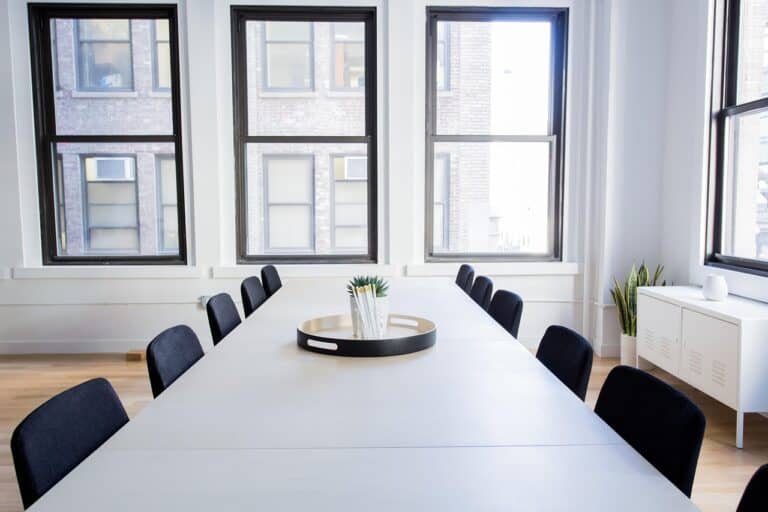 International federation meeting room with a long table and tall windows