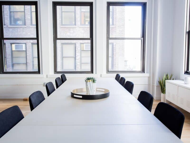 International federation meeting room with a long table and tall windows