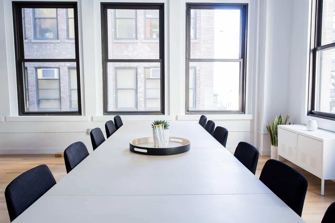 International federation meeting room with a long table and tall windows