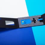 Digital Estonian e-Residency card and secure ID kit on blue background.
